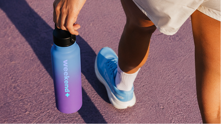 Weekend branded drinkware carried on a walk