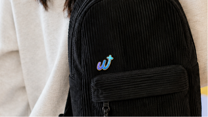 Weekend logo embroidered on a black backpack